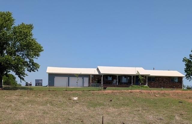 354504 E 980th Rd, Prague, OK 74864 - view of front of home with a garage and a front yard