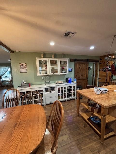 354504 E 980th Rd, Prague, OK 74864 - dining space with a barn door, recessed lighting, and dark wood finished floors