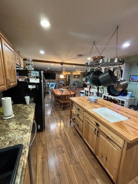 354504 E 980th Rd, Prague, OK 74864 - kitchen with butcher block countertops, freestanding refrigerator, dark wood finished floors, recessed lighting, and dishwasher