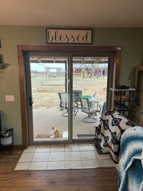 354504 E 980th Rd, Prague, OK 74864 - doorway with light wood-type flooring and healthy amount of natural light