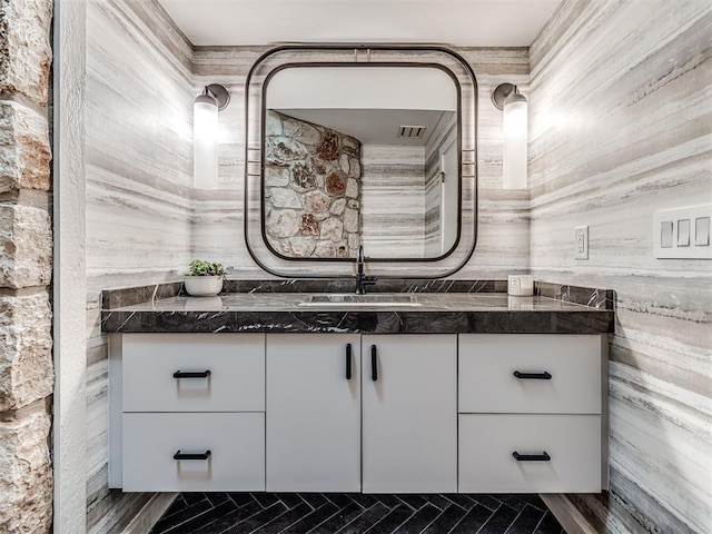 bathroom with visible vents and vanity