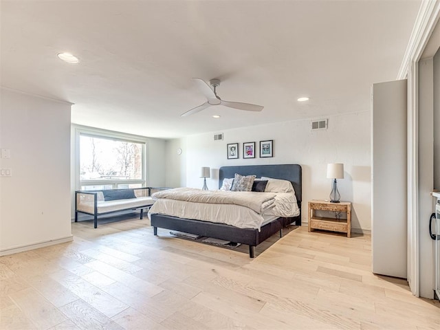 bedroom featuring light wood-type flooring, visible vents, a ceiling fan, and recessed lighting