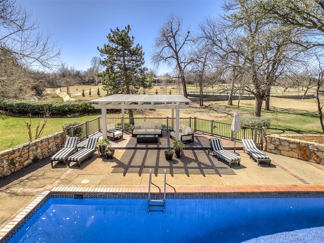 view of swimming pool with a patio area, a fenced in pool, a pergola, and an outdoor hangout area