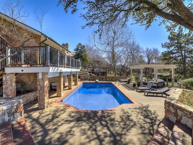 view of swimming pool featuring a diving board, a fenced in pool, a patio area, and a pergola