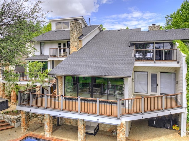 3108 Brush Creek Rd, Oklahoma City, OK 73120 - back of house with a balcony, a shingled roof, a chimney, and a carport