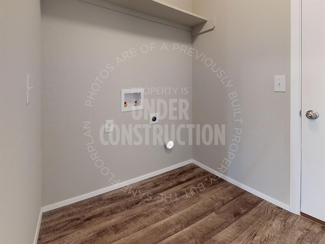 laundry room featuring dark wood-style flooring, hookup for a washing machine, hookup for an electric dryer, laundry area, and baseboards