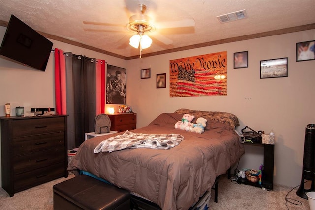 bedroom with light carpet, a textured ceiling, and visible vents