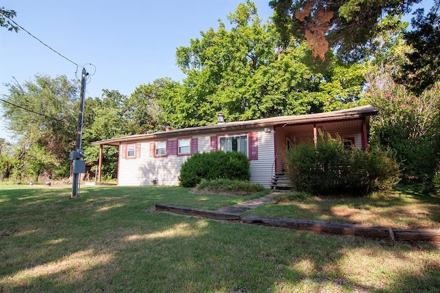 ranch-style house with a front lawn