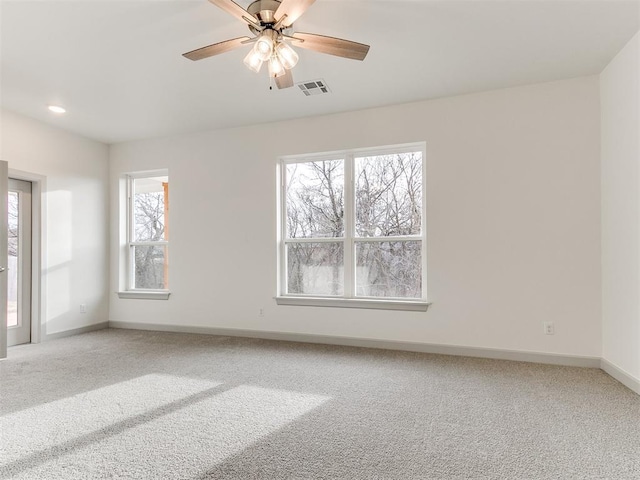 spare room with baseboards, visible vents, light colored carpet, ceiling fan, and recessed lighting