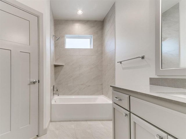 bathroom featuring vanity and shower / bathing tub combination