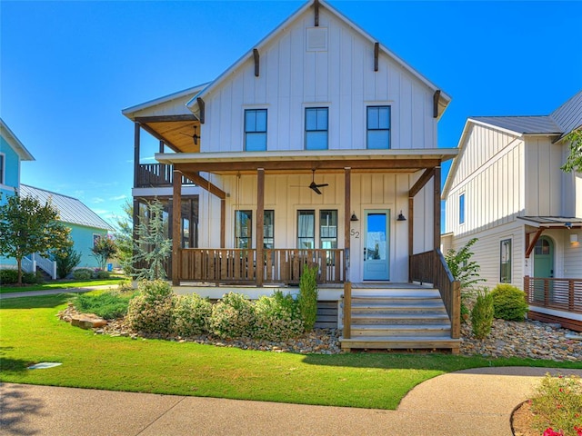 view of front of home featuring a porch, board and batten siding, and a front yard