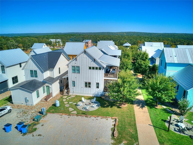 aerial view with a forest view and a residential view