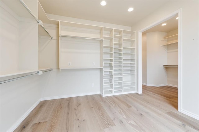 walk in closet featuring wood finished floors