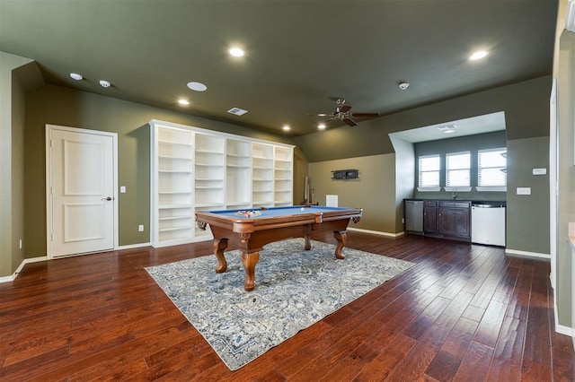 recreation room featuring dark wood-style floors, ceiling fan, baseboards, and vaulted ceiling