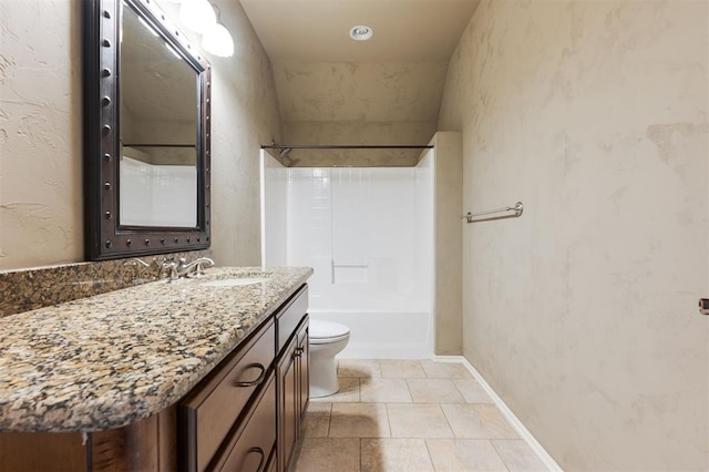 full bath with a textured wall, toilet, tub / shower combination, vanity, and baseboards