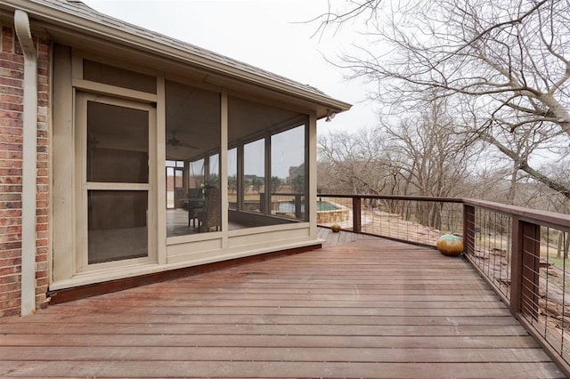 wooden terrace featuring a sunroom