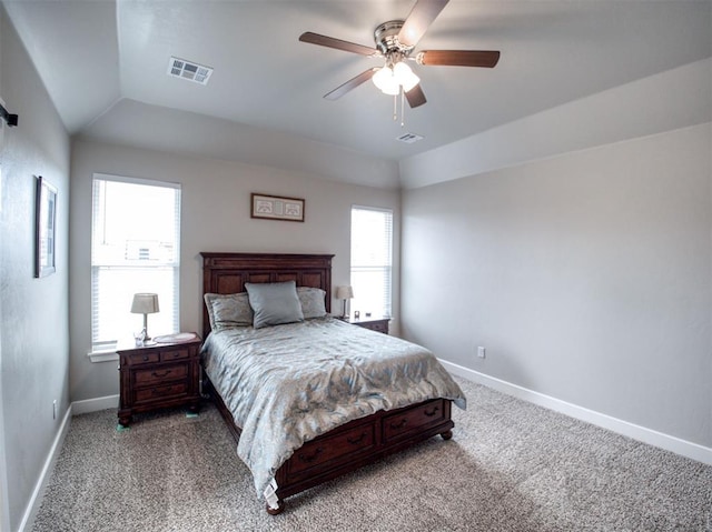 bedroom featuring baseboards, light colored carpet, and vaulted ceiling