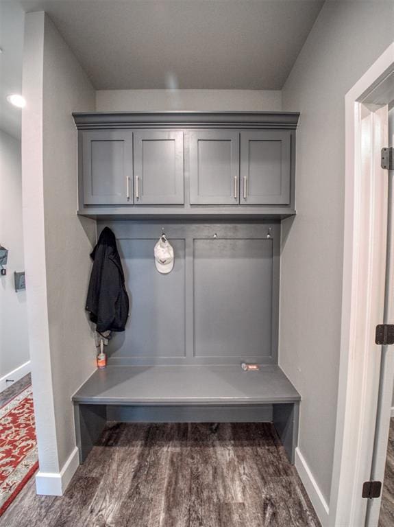 mudroom featuring baseboards and wood finished floors