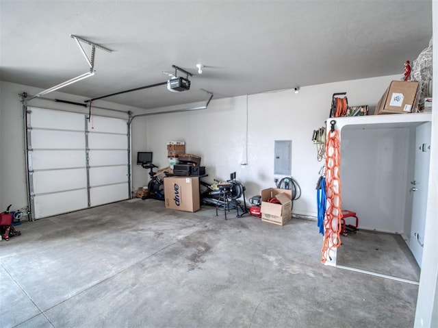 garage featuring electric panel and a garage door opener