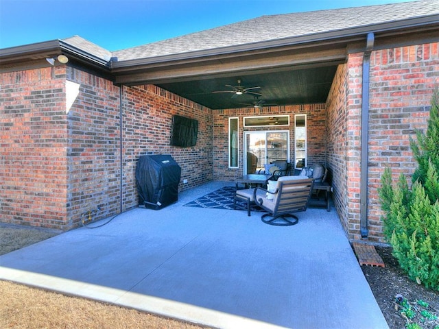 view of patio / terrace with a ceiling fan and a grill