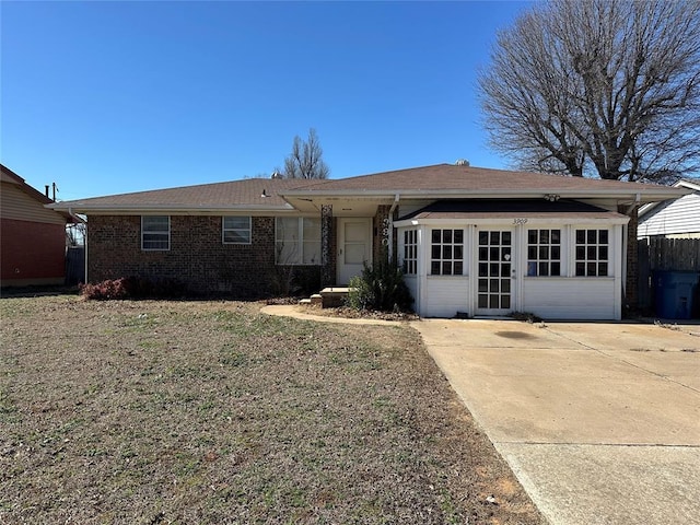 single story home with brick siding