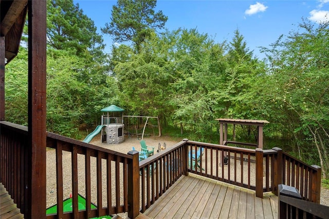 wooden terrace with a playground