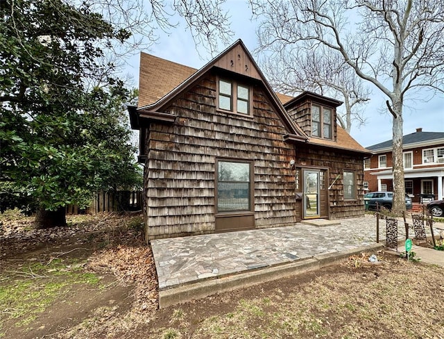 back of house with a patio