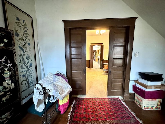 corridor with lofted ceiling