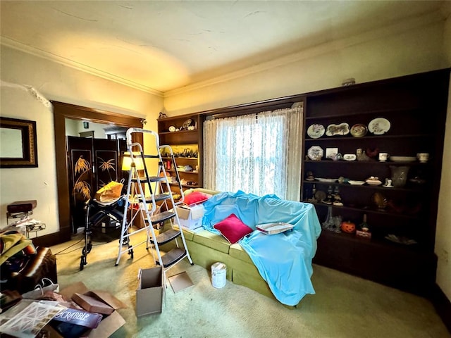 sitting room featuring crown molding