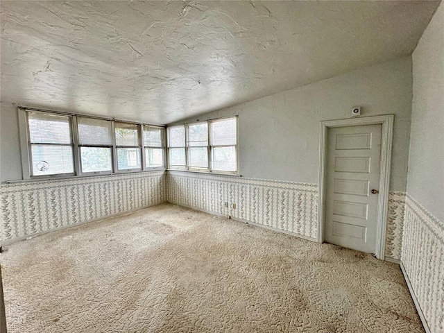 unfurnished sunroom featuring lofted ceiling