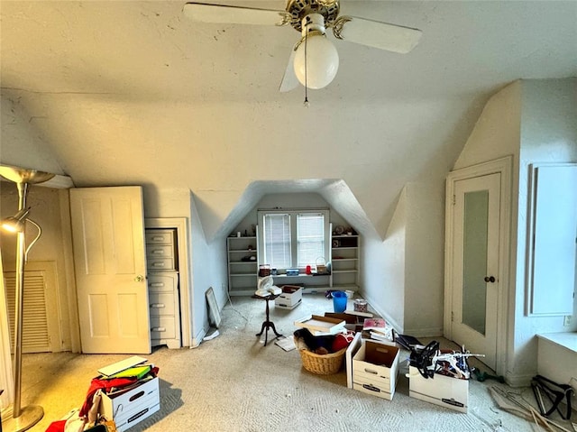 bonus room featuring a ceiling fan, lofted ceiling, and carpet