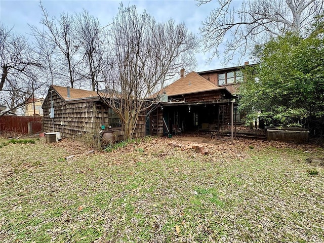 back of property featuring fence