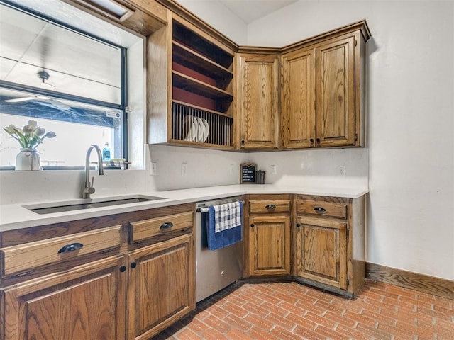 kitchen with dishwasher, open shelves, a sink, and brown cabinets