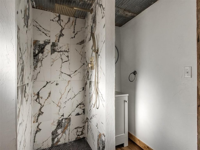 bathroom with a marble finish shower