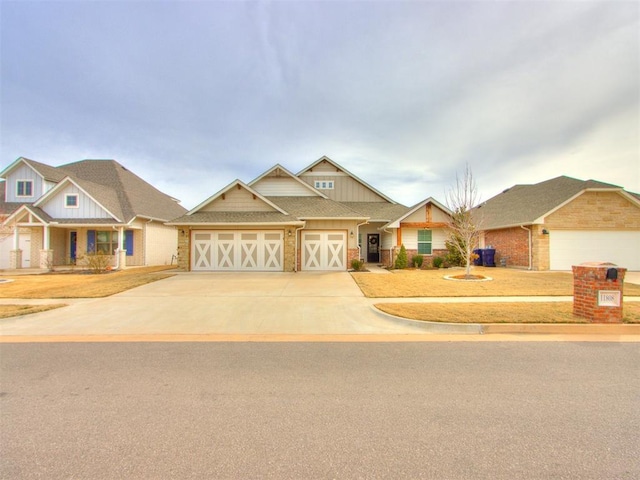 craftsman-style house with a garage, board and batten siding, concrete driveway, and brick siding