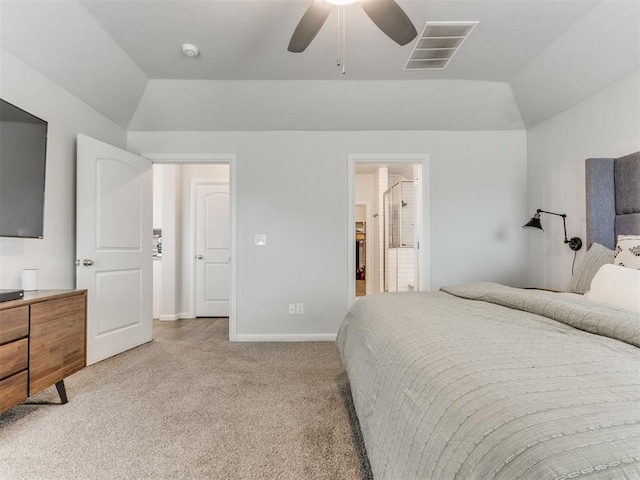 bedroom featuring light colored carpet, lofted ceiling, visible vents, and baseboards