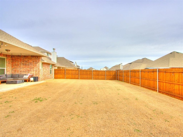 view of yard with cooling unit, a fenced backyard, and a patio