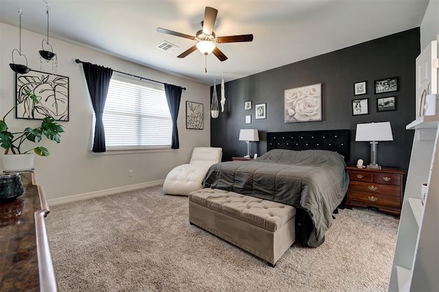 bedroom featuring carpet floors, a ceiling fan, visible vents, and baseboards