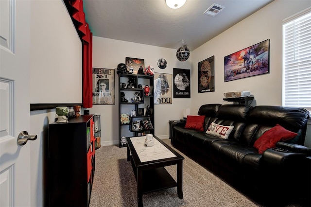 living room with baseboards, visible vents, and carpet flooring