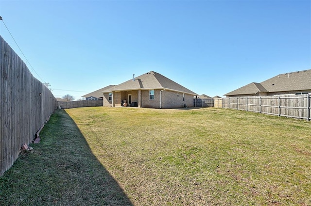 view of yard featuring a fenced backyard