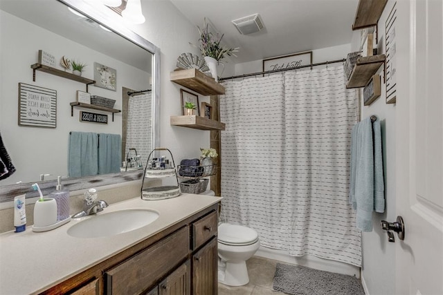 full bath with visible vents, toilet, shower / bath combo, vanity, and tile patterned floors