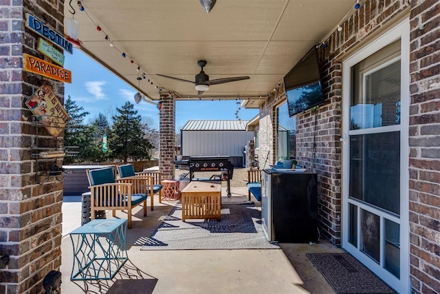 view of patio featuring ceiling fan