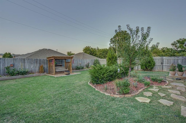 view of yard with a fenced backyard