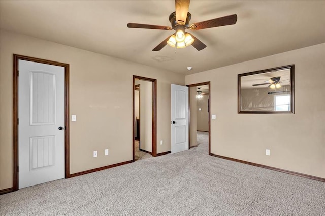 unfurnished bedroom with light carpet, baseboards, and a ceiling fan