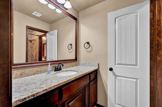 bathroom featuring visible vents and vanity