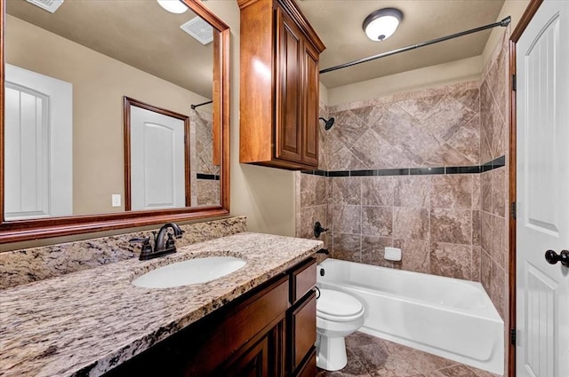 bathroom with visible vents, toilet, shower / tub combination, tile patterned flooring, and vanity