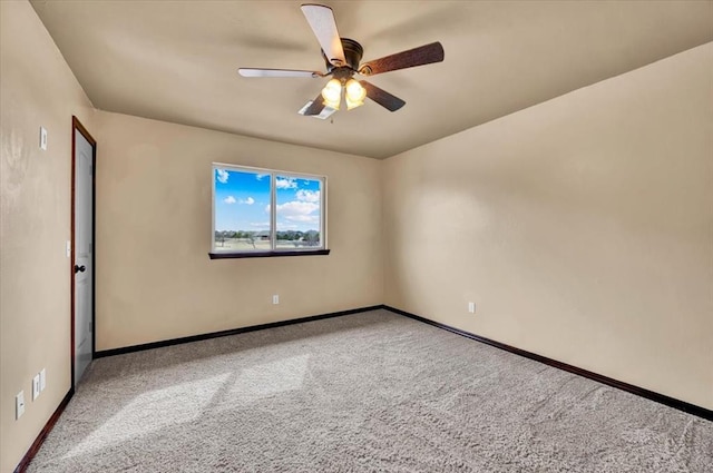 unfurnished room with ceiling fan, carpet, and baseboards