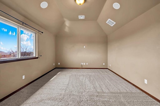 bonus room featuring lofted ceiling, carpet, visible vents, and baseboards