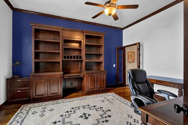 office space with ornamental molding, dark wood-type flooring, and a ceiling fan