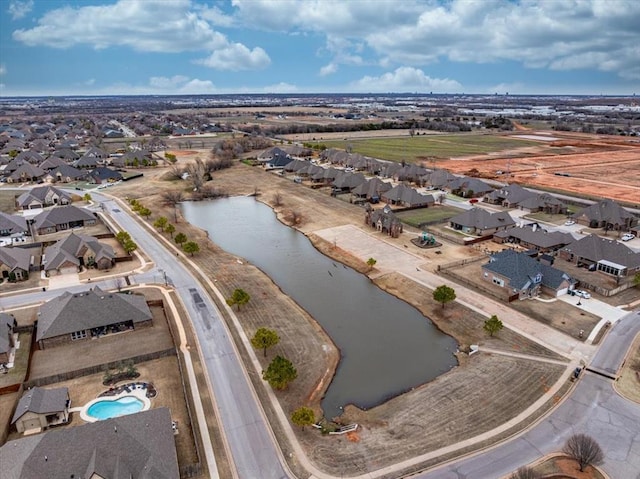 aerial view with a residential view and a water view